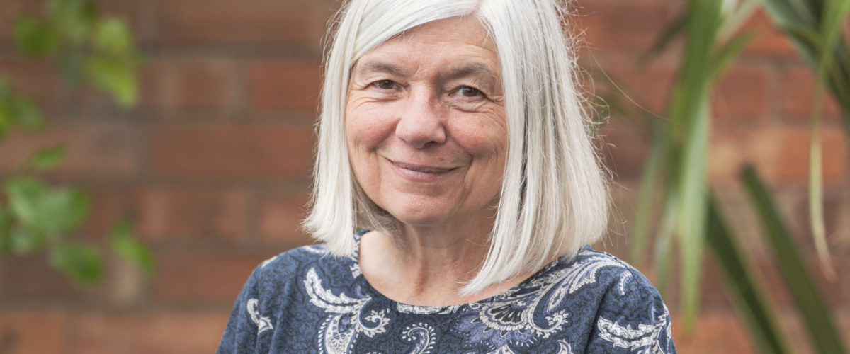Headshot of Stella Dickie, Head of Corporate Services smiling at the camera