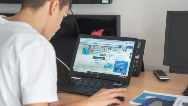 Student using a laptop in the classroom