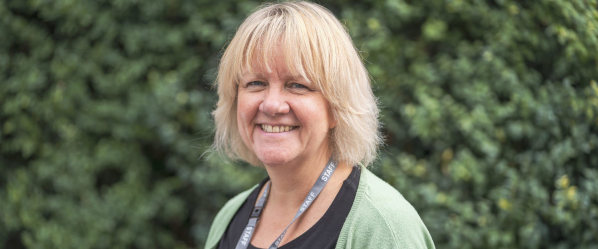 Headshot of Principal Tracey Forman smiling at the camera