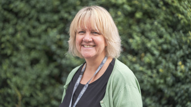 Headshot of Principal Tracey Forman smiling at the camera