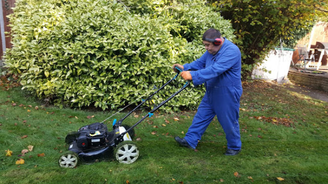 Day Service member moving the lawn