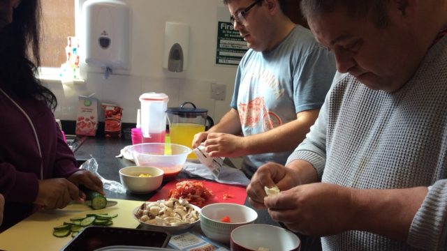 Day Service members preparing a meal