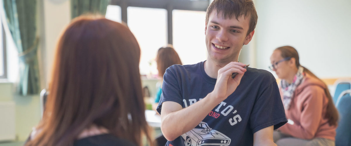 Student talking with tutor in their session