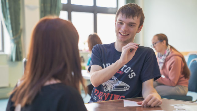 Student talking with tutor in their session