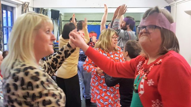 Day Service members dancing at the Christmas party