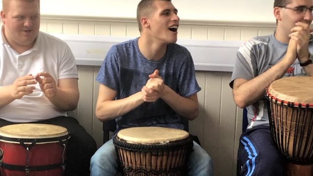 Day Service members using african drums