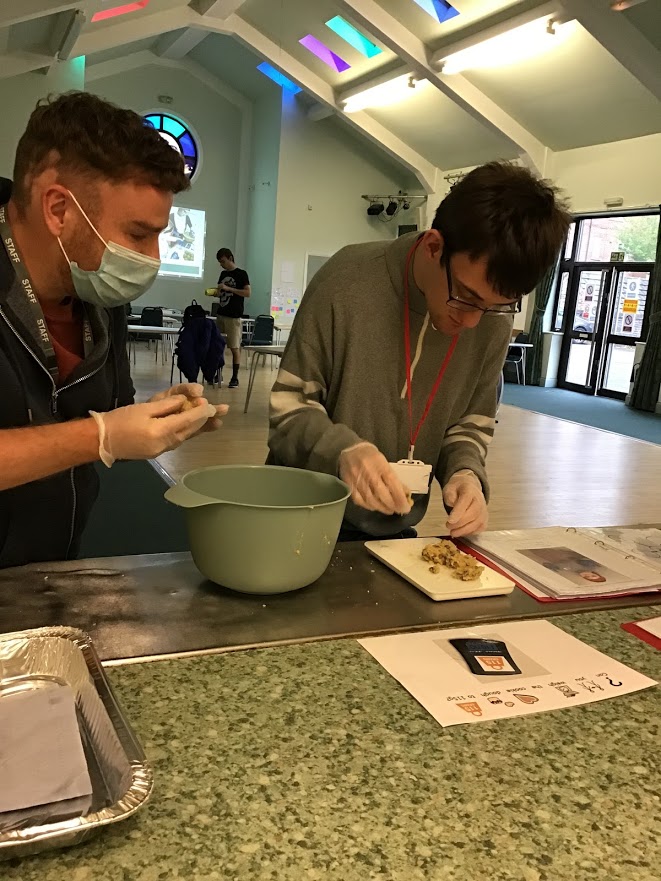 Student using resources to weigh the perfect cookie