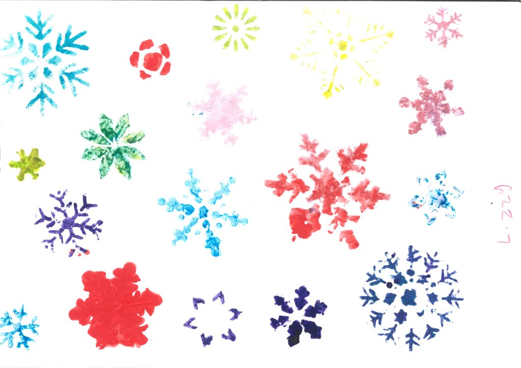 Different coloured stencilled snowfakes