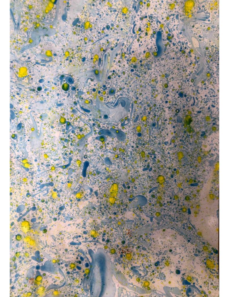 Ink and water paint patterns in yellow and blue