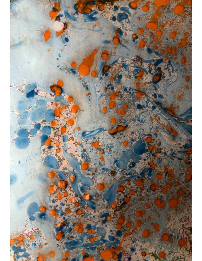 Ink and water paint patterns in orange and blue