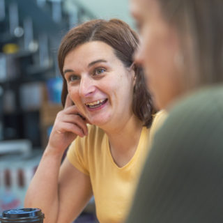Staff member talking to someone off camera