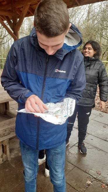 Student reading a map