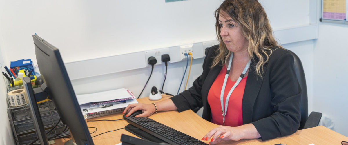 Staff member working at computer