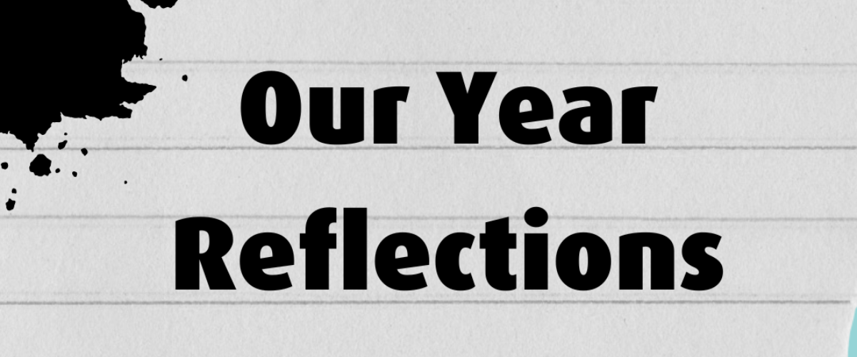 text on notebook paper, text reads: 'Our Year Reflections'