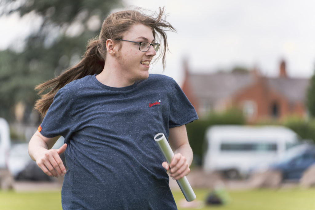 Student running with baton