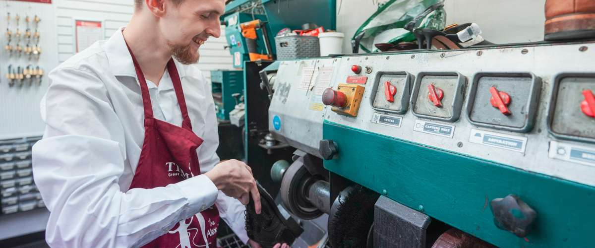 Student polishing shoe at Timpson