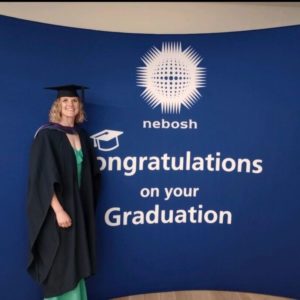 Staff member at NEBOSH graduation