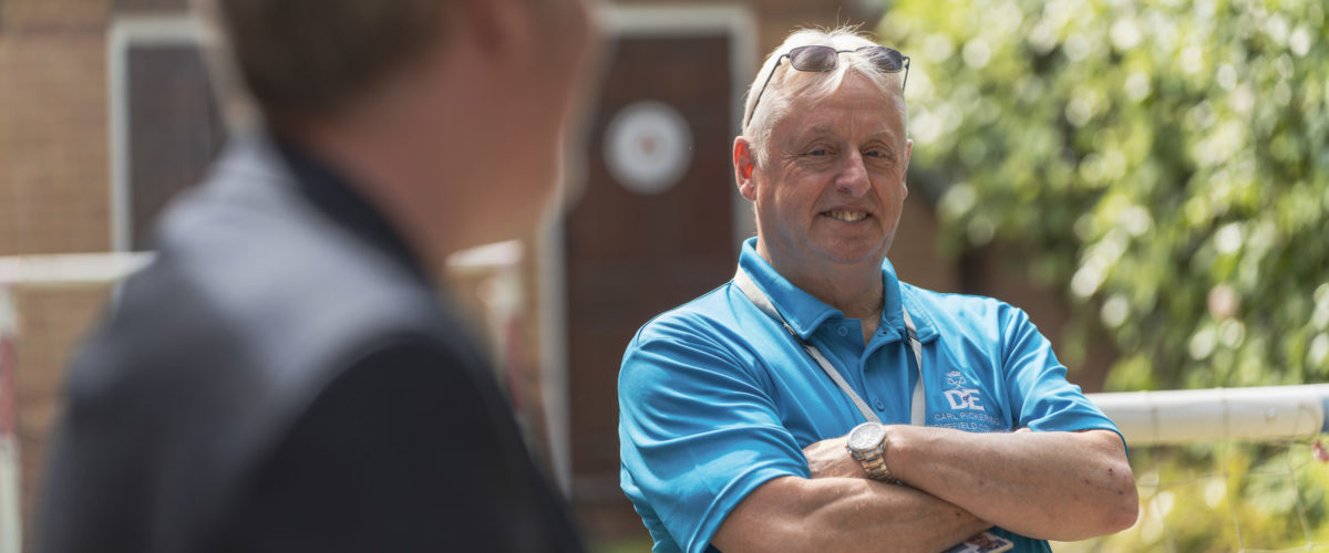 Carl Pickering, Duke of Edinburgh Co-ordinator smiling at the camera