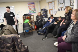 Group of students and staff listening to a talk by a former Homefield student