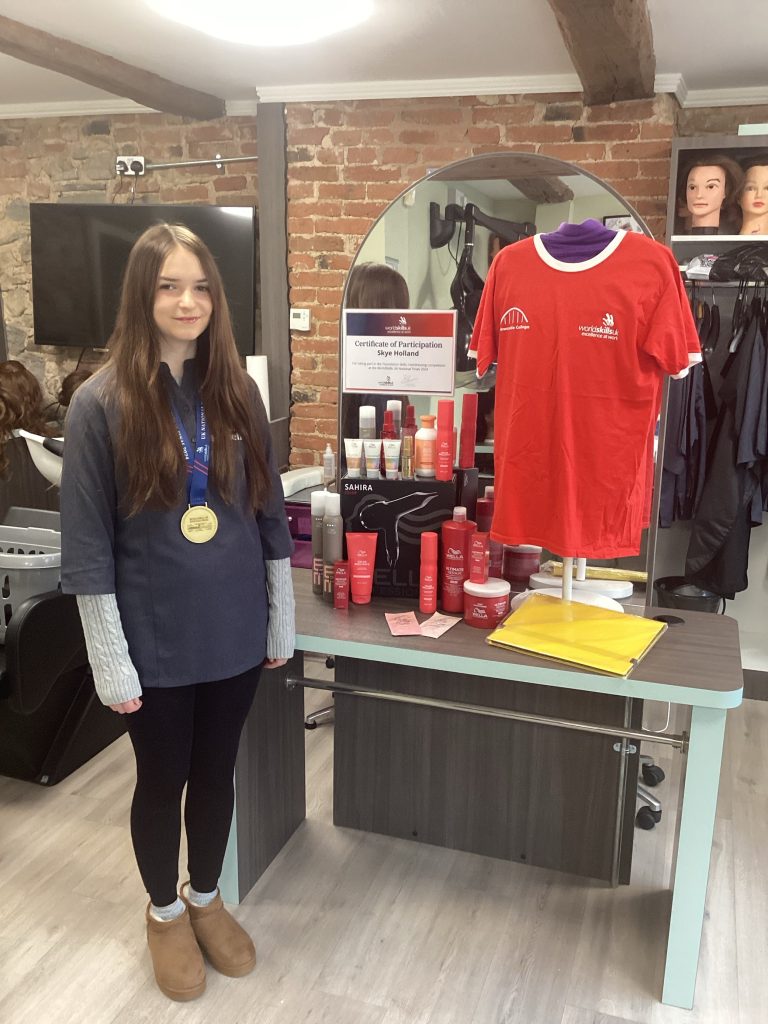 Skye wearing her gold medal and smiling proudly at the camera.