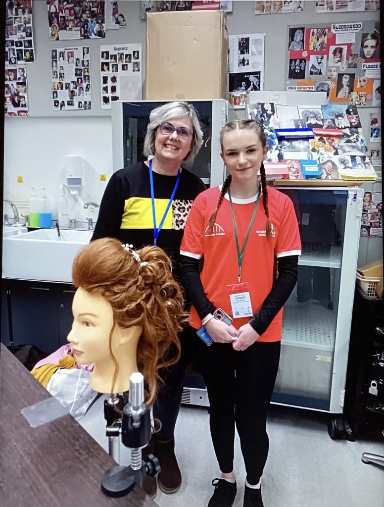 Skye and her tutor smiling a the camera, next to the finished product of the hairdressing look.