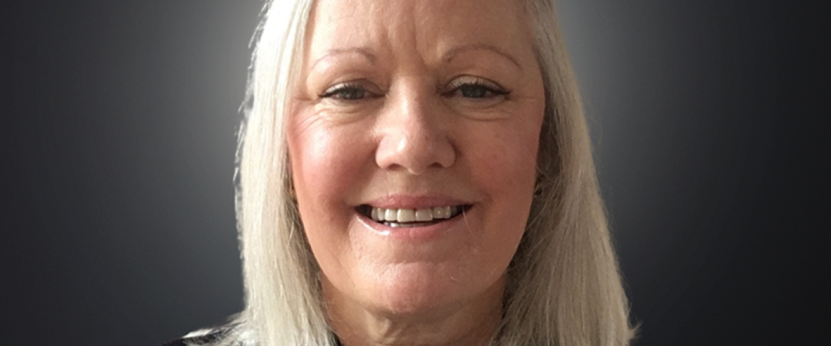 Headshot of trustee Audrey Traynor, smiling at the camera