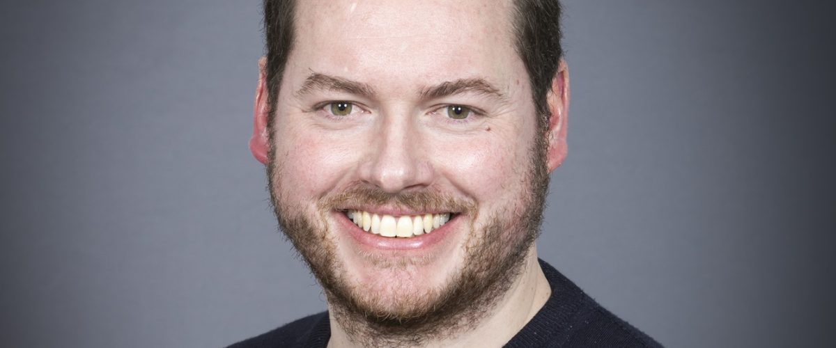 Headshot of trustee Peter Smart, smiling at the camera