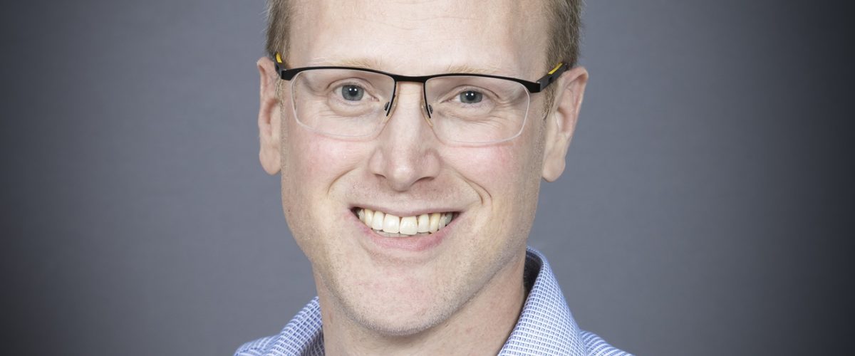 Headshot of trustee Andy Clifton, smiling at the camera