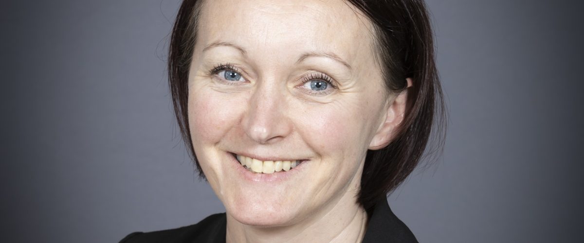 Headshot of Jenni Scothern smiling at the camera
