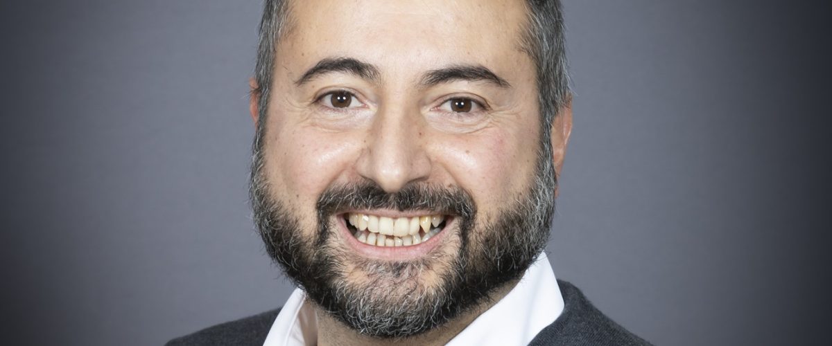 Headshot of trustee Gianluca Paderi, smiling at the camera