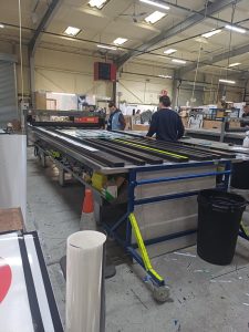 Student Elliott working in the Nuneaton Signs warehouse