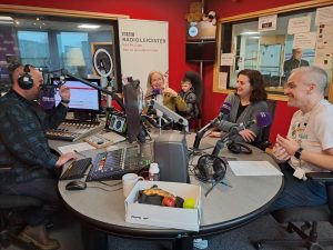 BBC Radio Leicester host Ady Dayman, Chris, Rebekah, Danni and son Arlo in the studio, smiling and chatting.