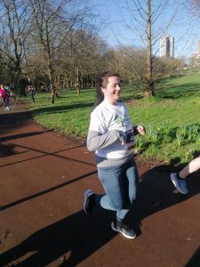 A picture of staff member Katie running.