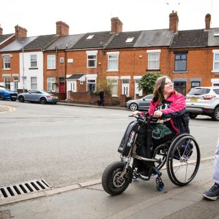 a staff member and a student doing the daily mile out in the local community