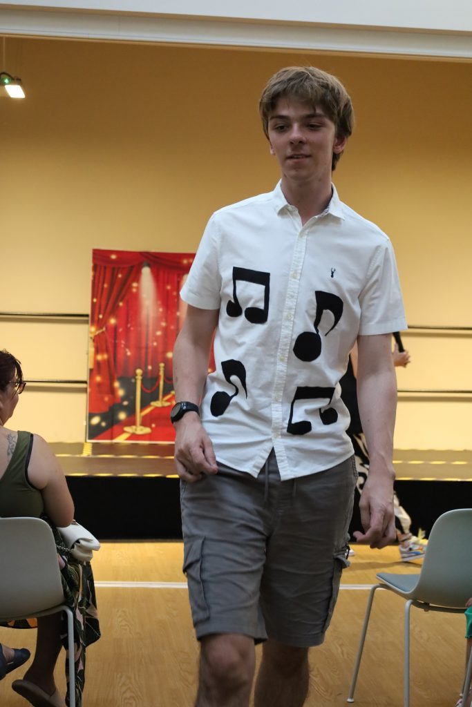 student wearing musical shirt