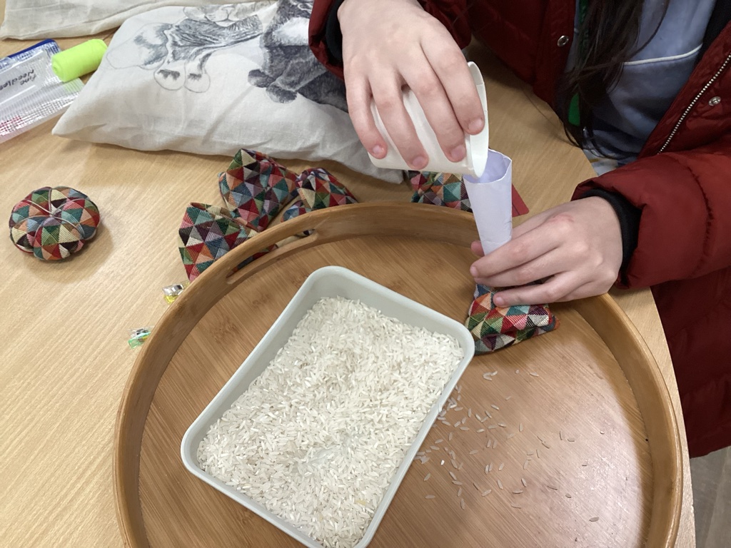 hands filling sewing weights